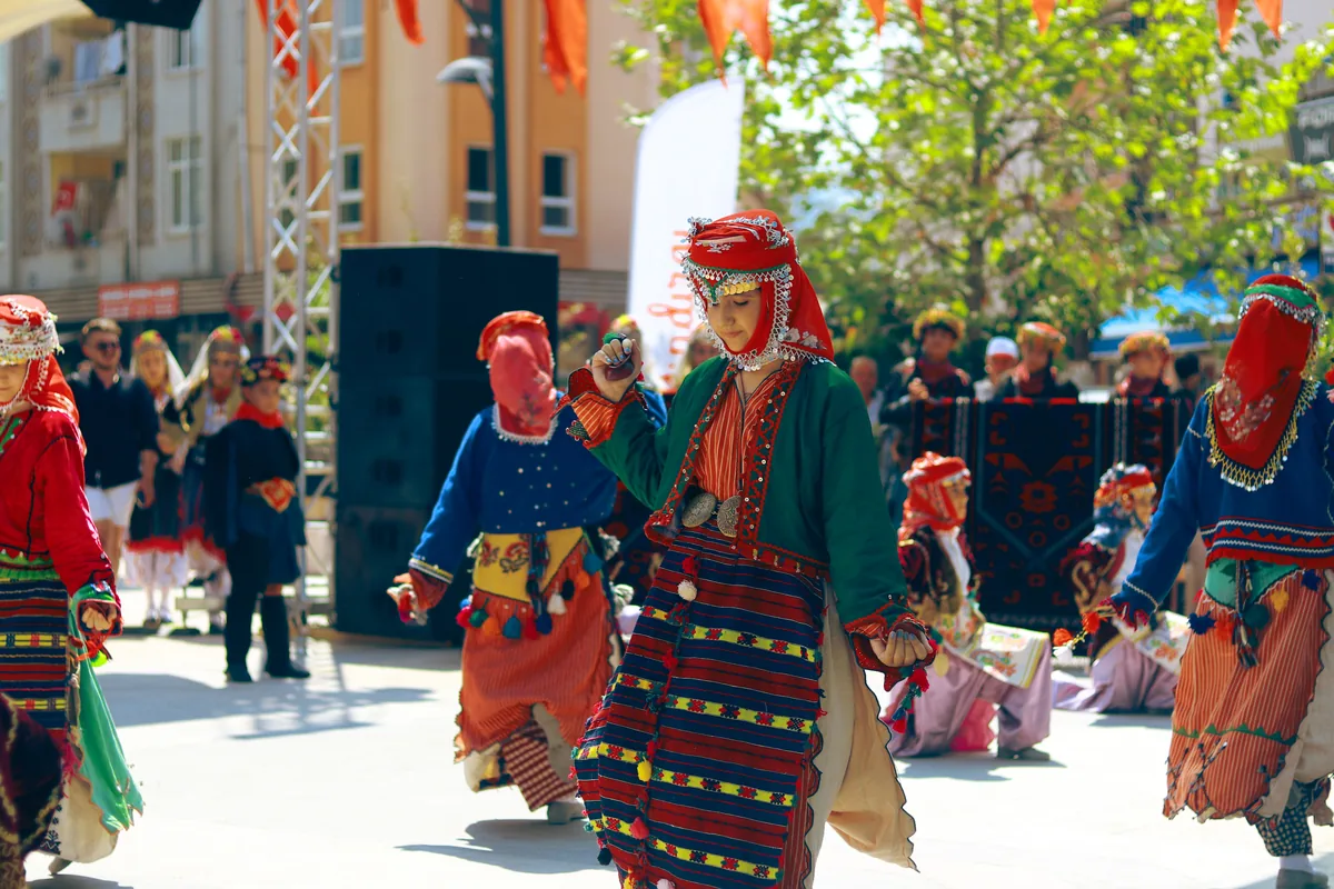 Dancers in bright traditional costume performing