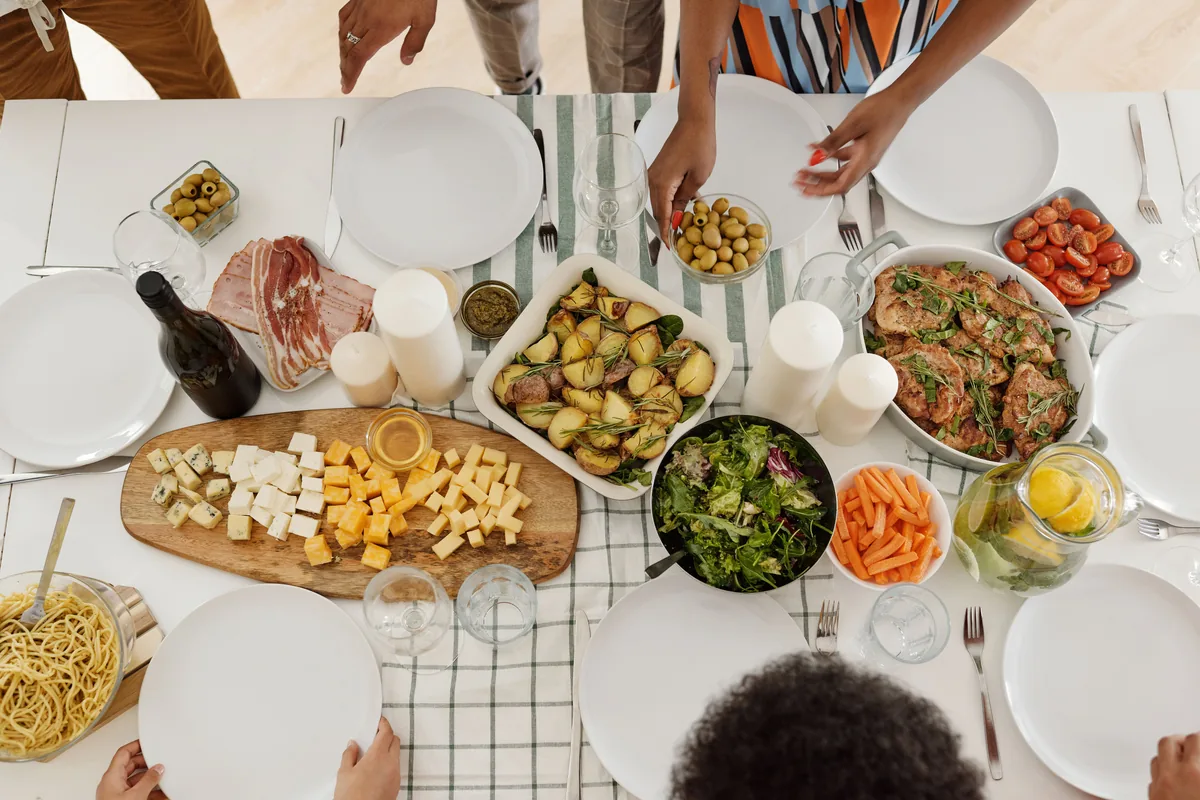 A long table set with many small shared dishes